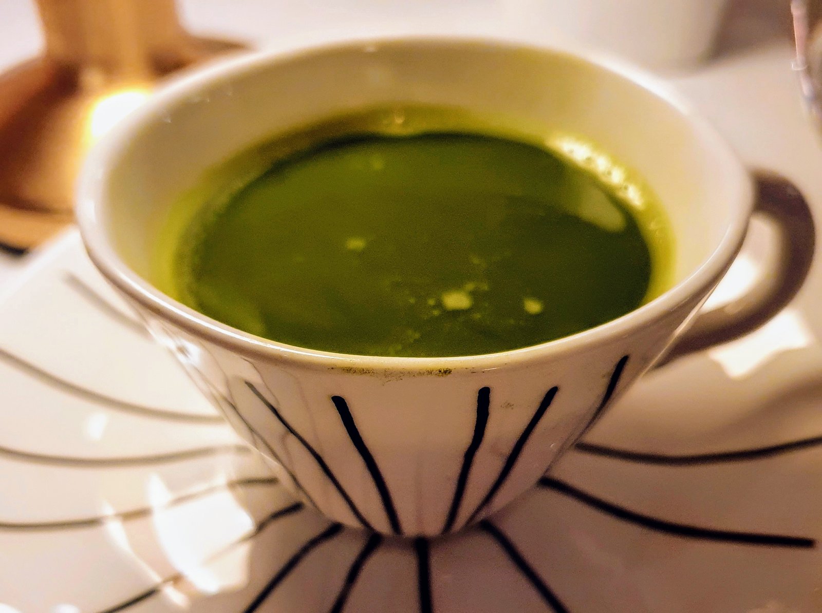 A cup of green matcha tea as part of afternoon tea at Sketch., Mayfair, London