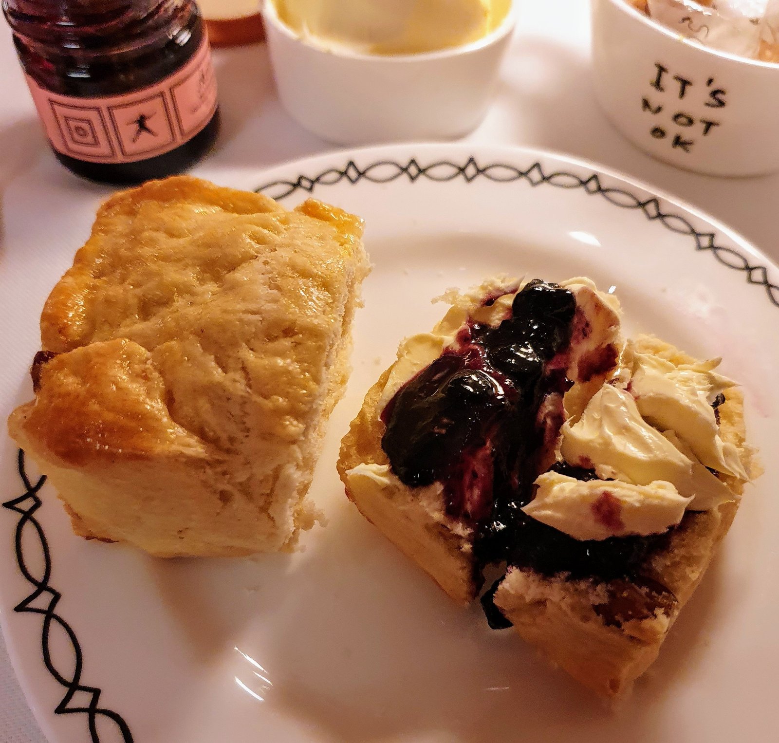 Warm sultana scone with Cornish clotted cream and blueberry & orange blossom jam. Afternoon tea at Sketch, Mayfair, London