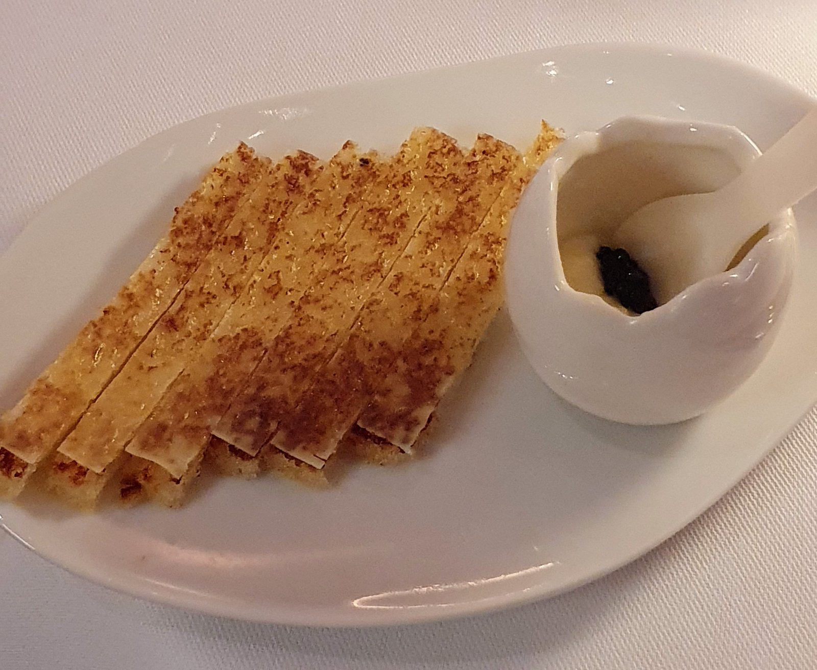 A clever twist on the traditional egg and soldiers with Comté cheese Mornay and caviar, part of afternoon tea at The Gallery at Sketch. Mayfair, London