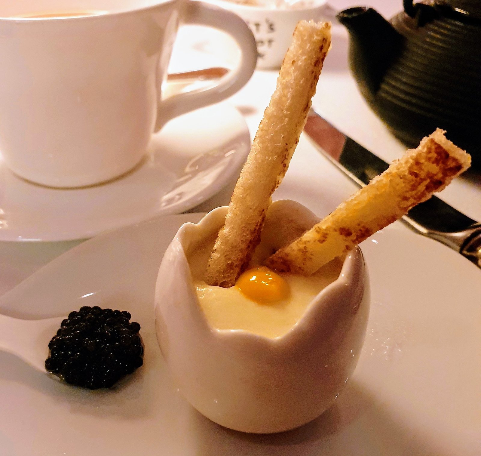 A clever twist on the traditional egg and soldiers with Comté cheese Mornay and caviar, part of afternoon tea at The Gallery at Sketch. Mayfair, London