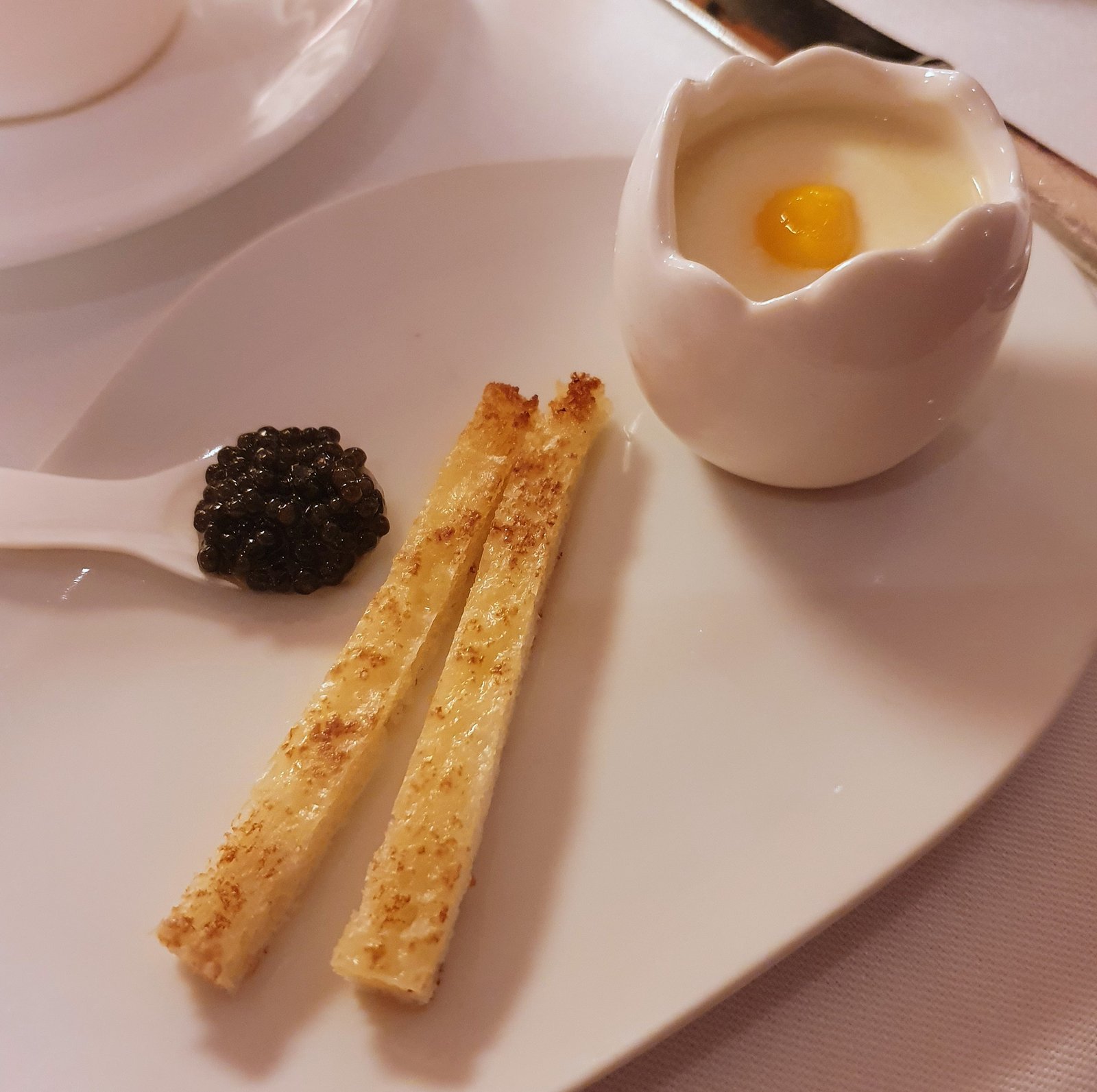 A clever twist on the traditional egg and soldiers with Comté cheese Mornay and caviar, part of afternoon tea at The Gallery, Sketch, London