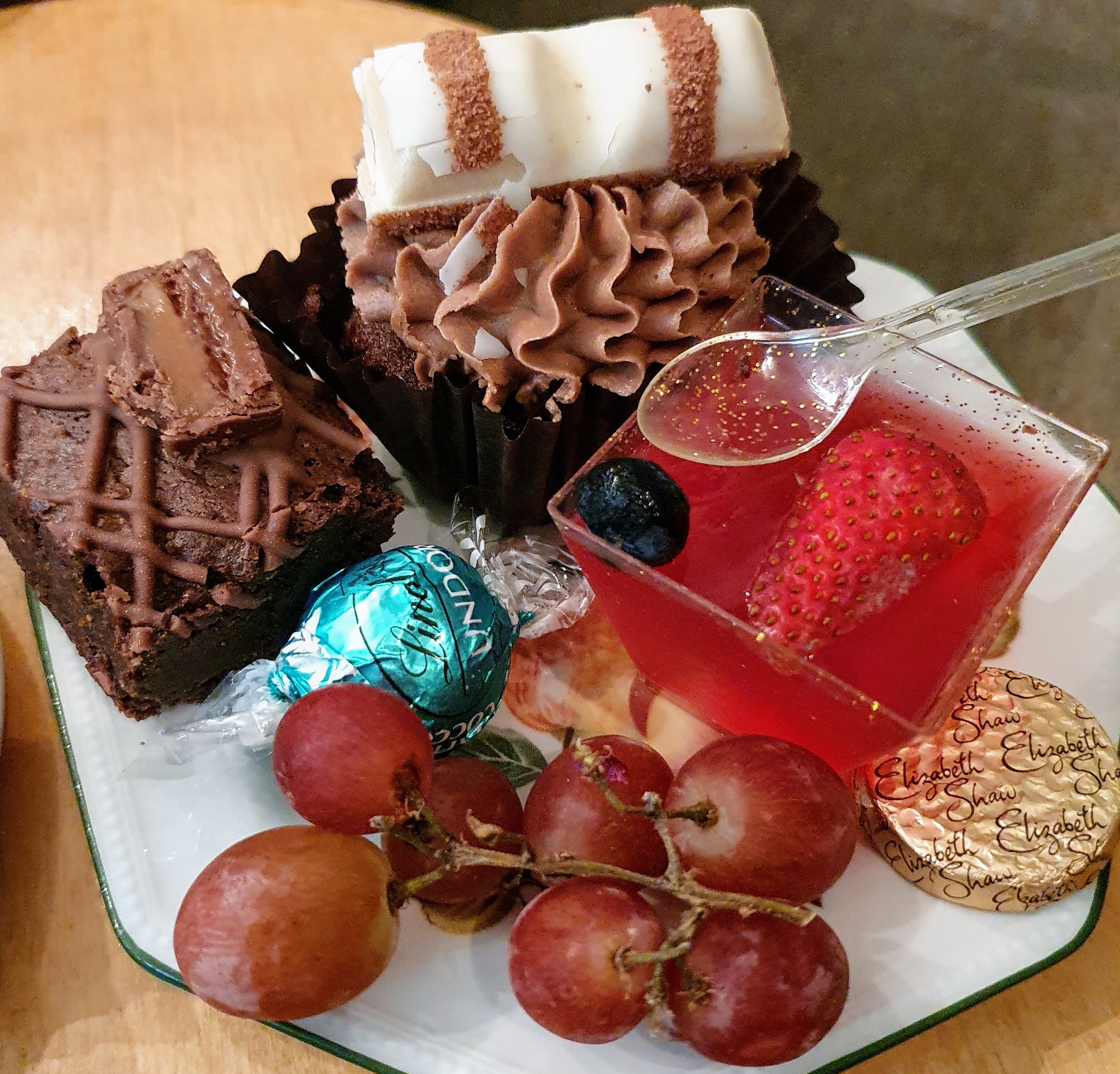 Takeaway afternoon tea with a cupcake, brownie, chocolates, grapes and jelly from Dolly Birds Mobile Catering, Staffordshire