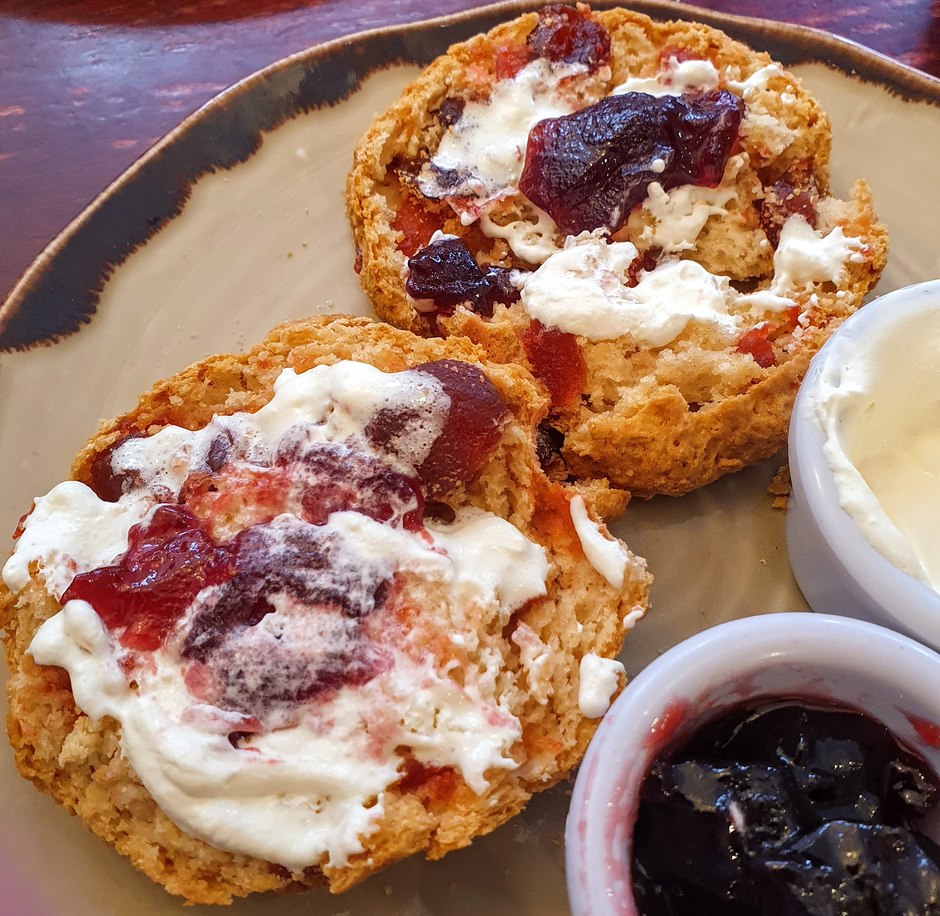 Warm cherry scone covered in jam and cream, Coffee Beans Café, Leek, Staffordshire