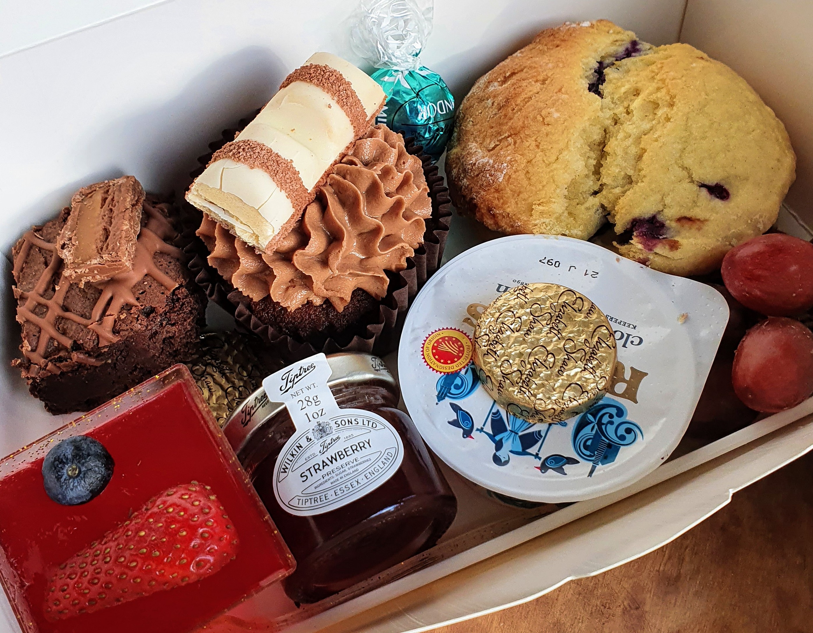 Takeaway afternoon tea with a scone, cupcake, brownie and jelly from Dolly Birds Mobile Catering, Staffordshire