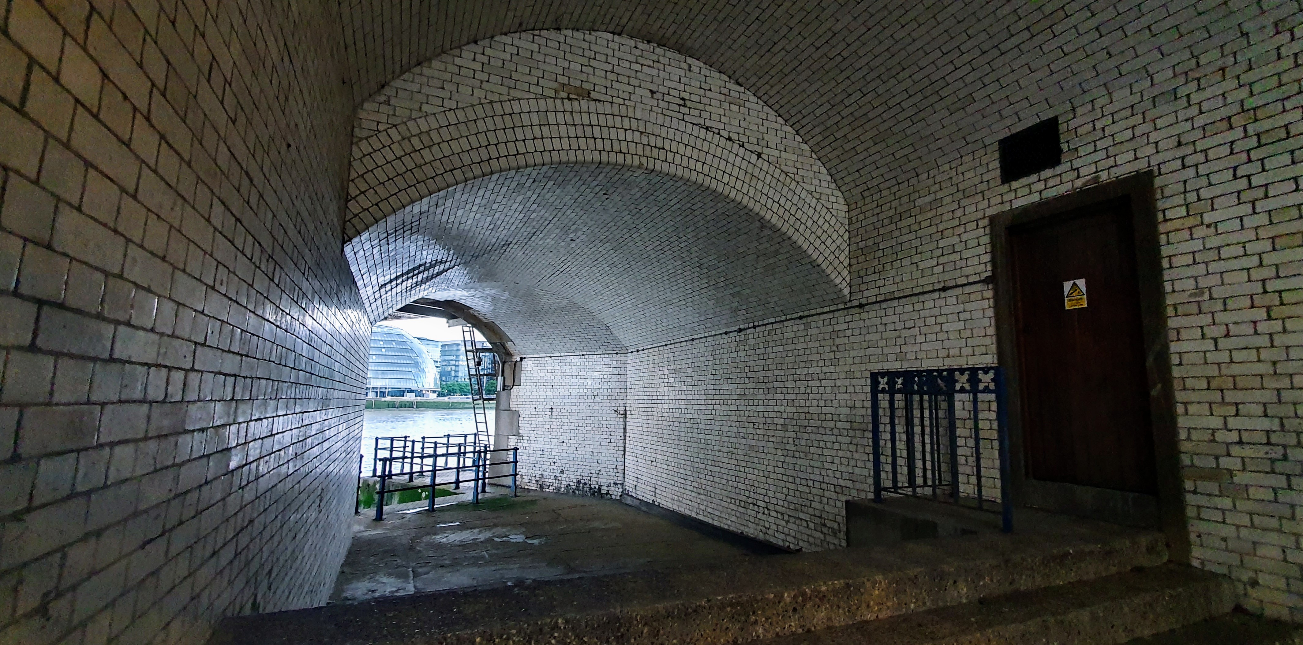Tiled former mortuary alcove beneath the north tower of Tower Bridge, known as Dead Man's Hole